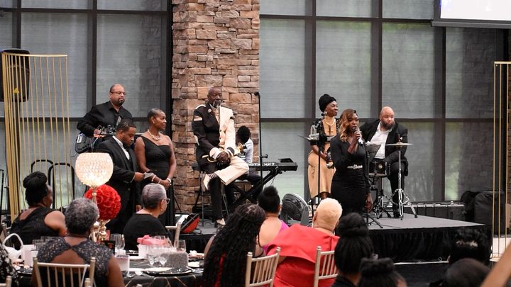 The band on stage as guests dine