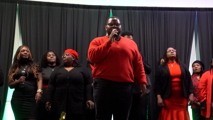 The choir in red and black