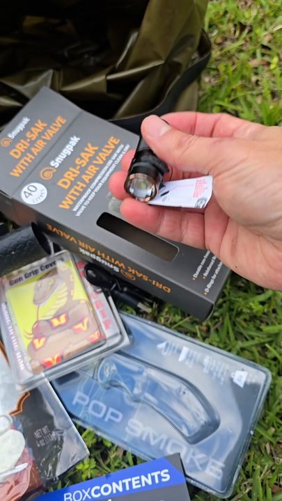 A spread of box contents on the grass