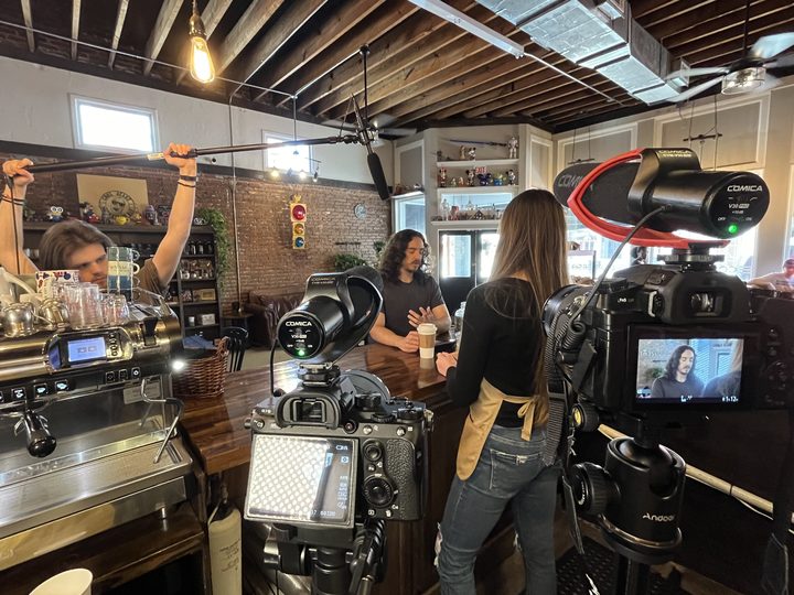 A two-camera setup for a cafe scene