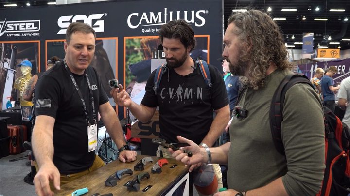 Talking shop at a knife booth