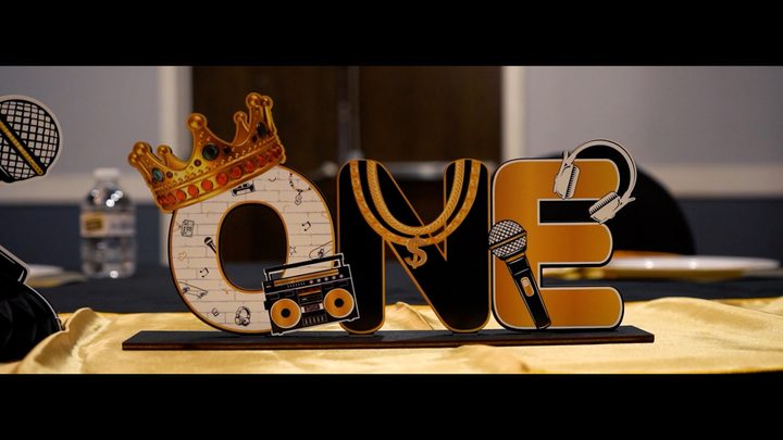 A crown and boombox 'ONE' centerpiece