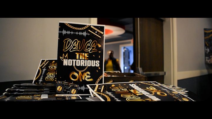 Party signs reading 'Deuce the Notorious One'