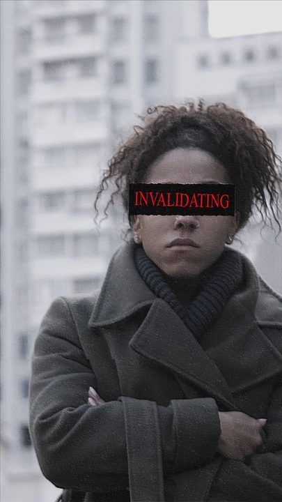 A woman in a coat with 'INVALIDATING' over her eyes